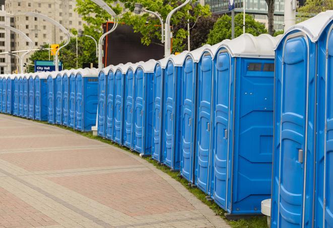 a row of portable restrooms ready for eventgoers in Bloomfield IN